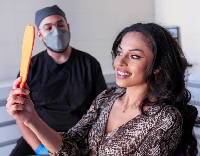 Patient looking her dental results
